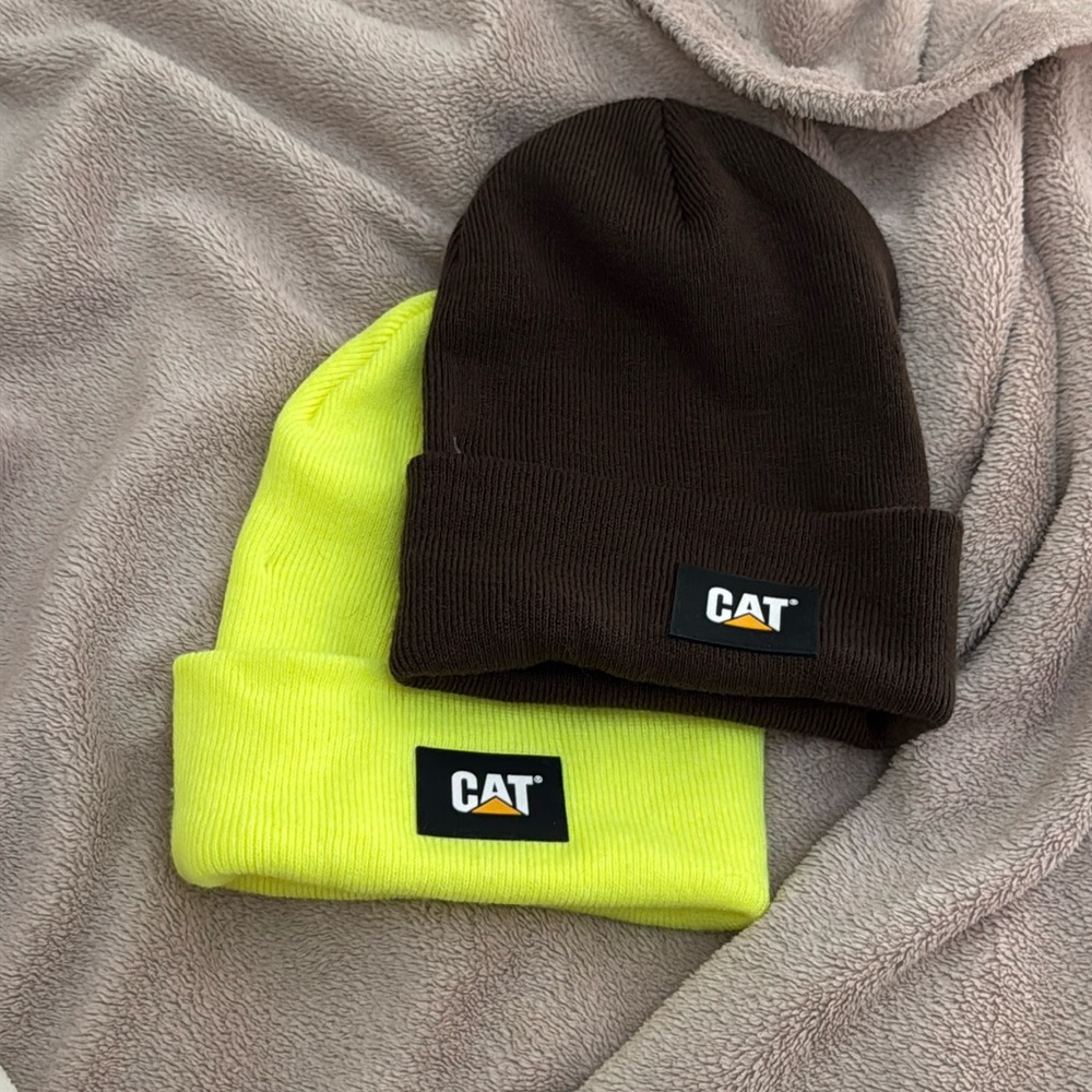 2 CAT beanies - unworn - still have the plastic tag fasteners attached…